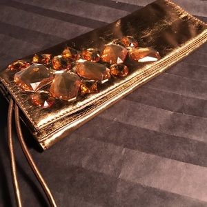 Gold Lamai clutch bag by Stuart Weisman